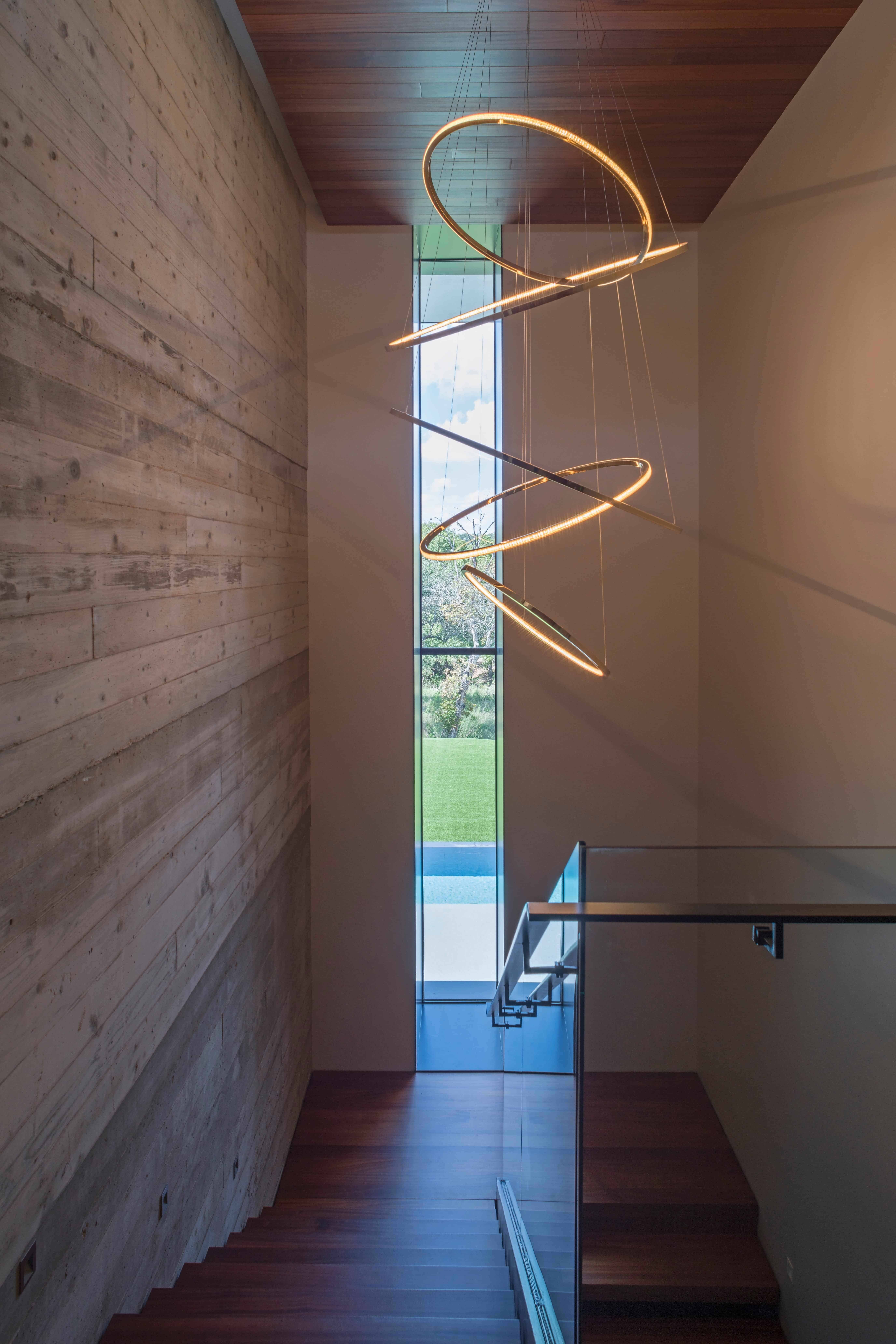 Modern Light Fixtures hanging in staircase