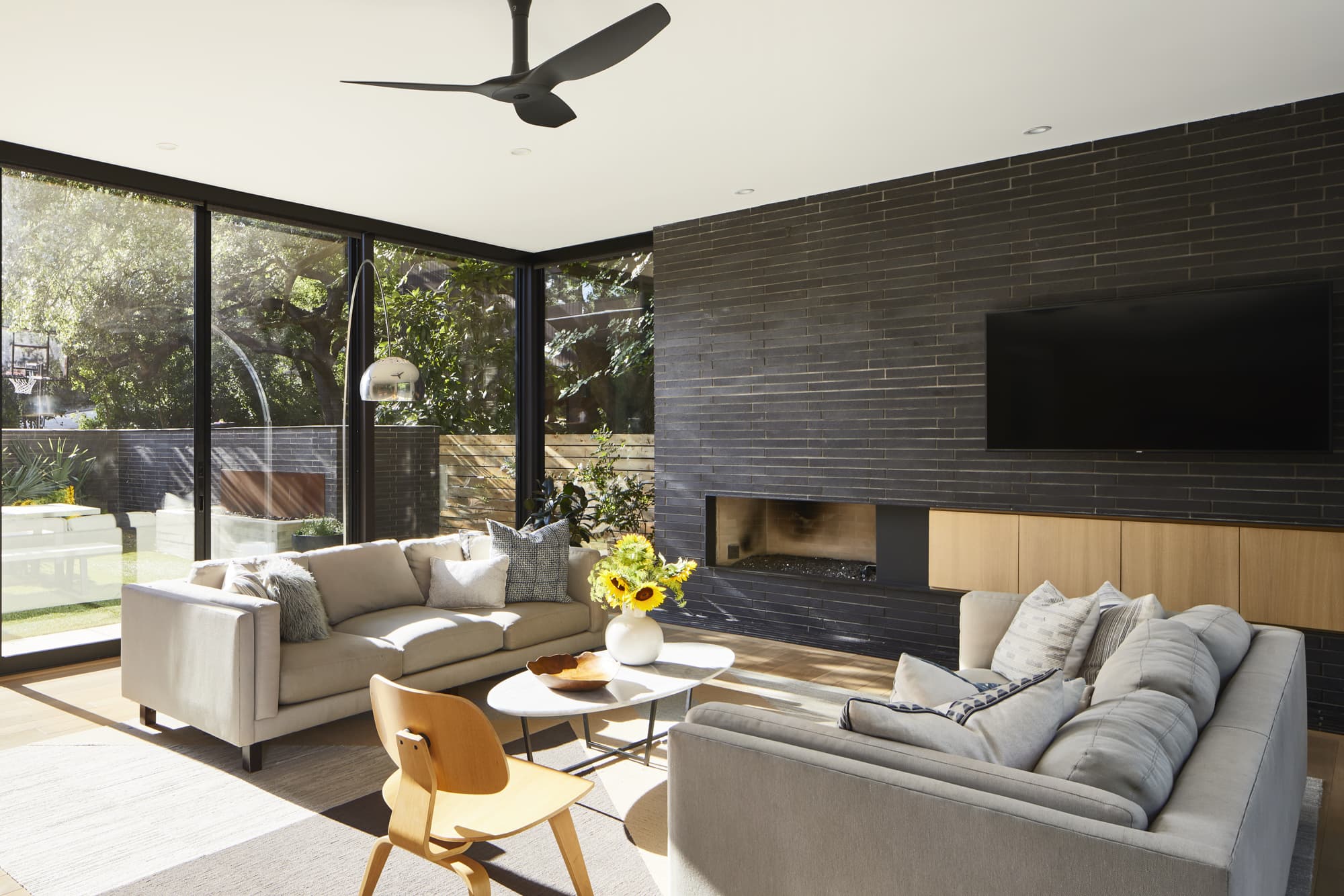 View of Living Room with large windows in modern home designed by Austin, Texas Architect Jay Corder